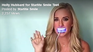 Holly Hubbard demonstrates the Starlite Smile Teeth Whitening Light